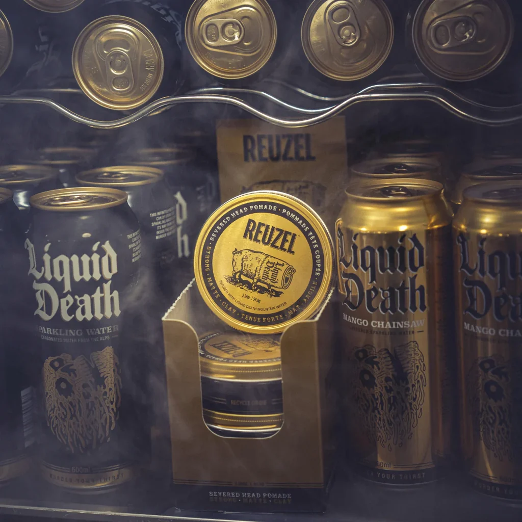 Reuzel Severed Head clay pomade tin in gold packaging