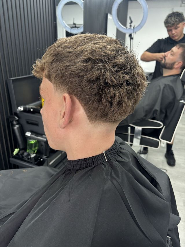 Messy textured crop with a low taper fade